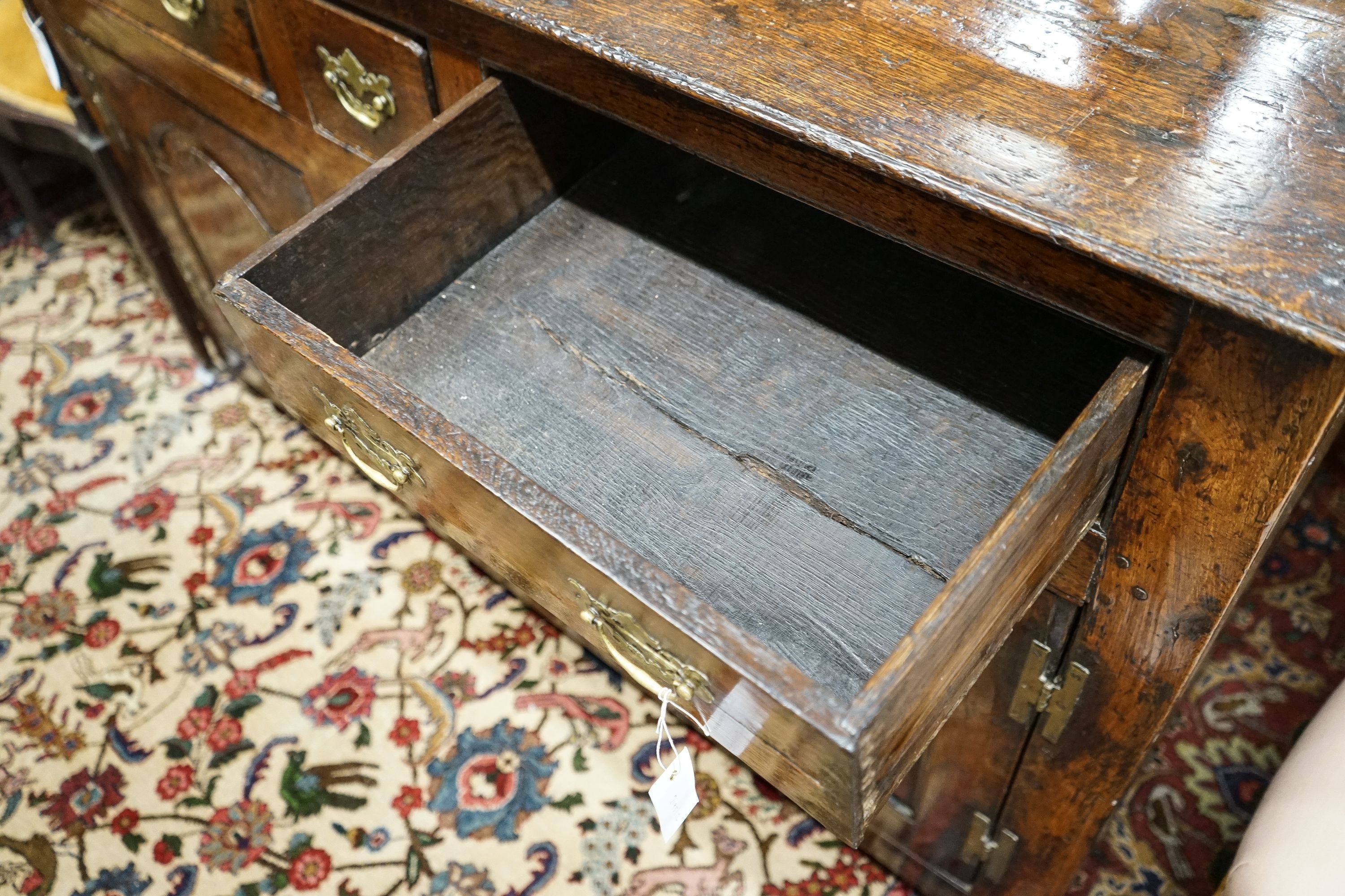 A mid 18th century oak dresser base, length 140cm, depth 55cm, height 88cm